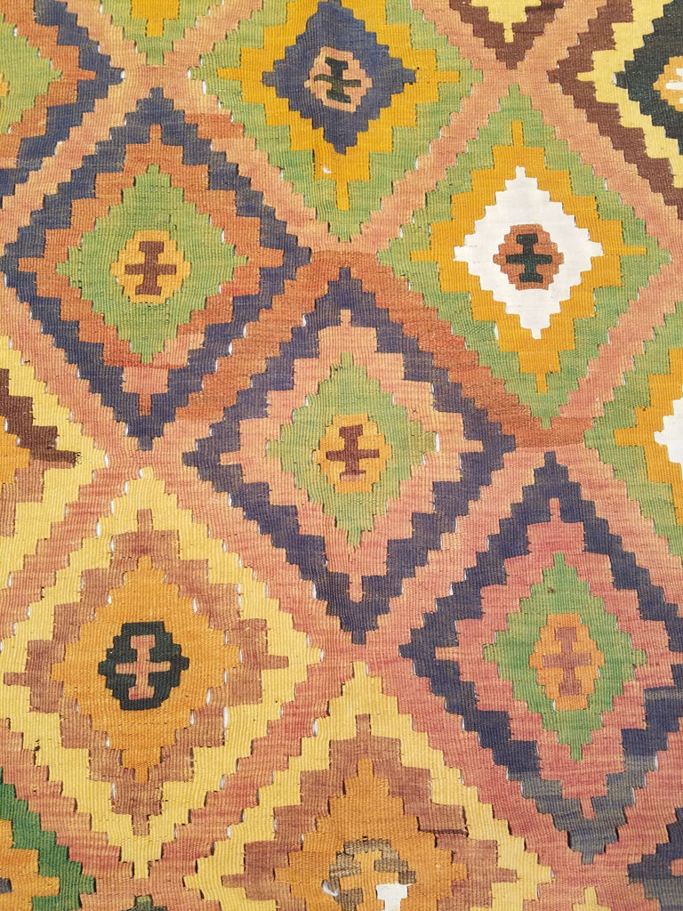 4'9" x 8'5"   Persian Vintage Qashqai Kilim Rug Angle View